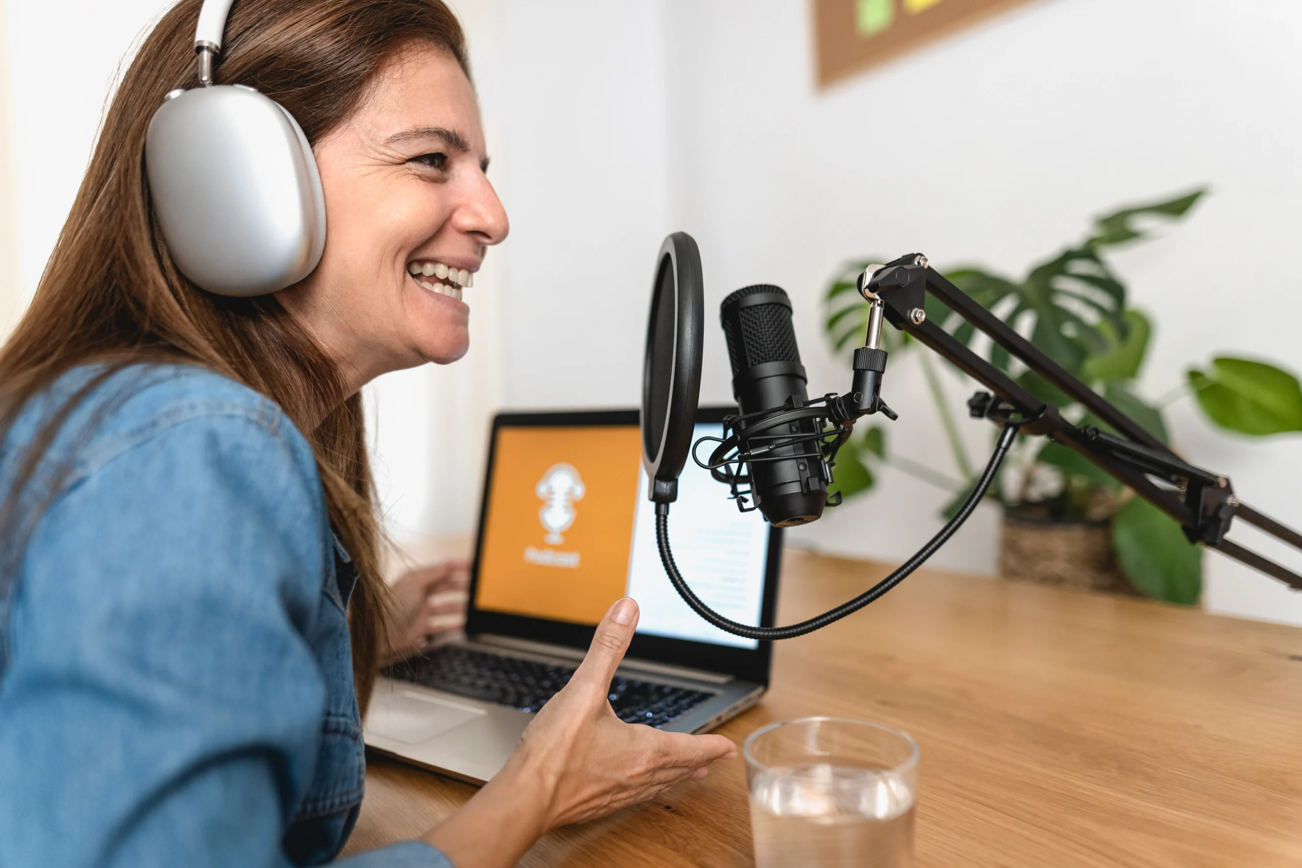 Streaming Audio Women with Headphones, Microphone, Laptop